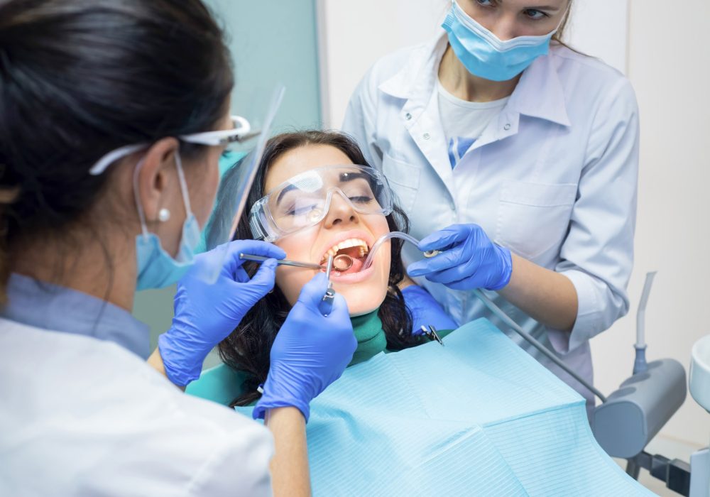 two-dental-doctors-and-patient.jpg